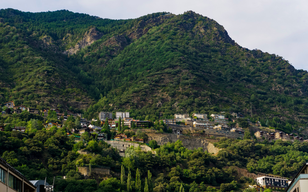 Places to visit near Dehradun under 200 km: Lansdowne's pine-lined cantonment road at dusk and the Bhagirathi River flowing clear and fast through Uttarkashi
