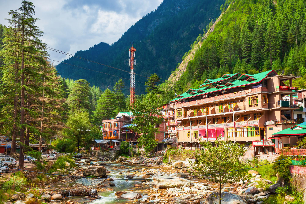 Best Places to Visit in Kasol with the Parvati River, Chalal trail, Kasol market, Tosh village, and Parvati Valley hills in the background.