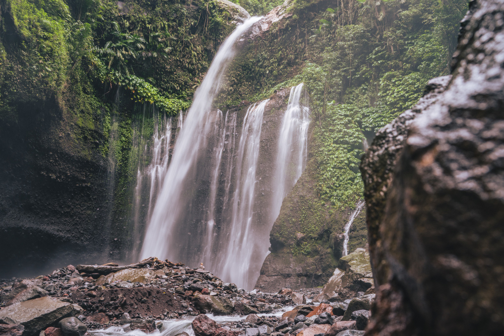 Waterfall cascading through green Sahyadri hills during peak season for waterfalls near mumbai monsoon