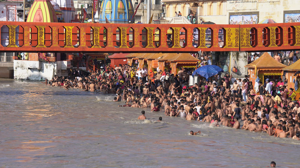 Places to visit near Delhi under 250 km: Har Ki Pauri ghat at Haridwar lit at dusk and the Taj Mahal reflected in the Yamuna at sunrise from Agra