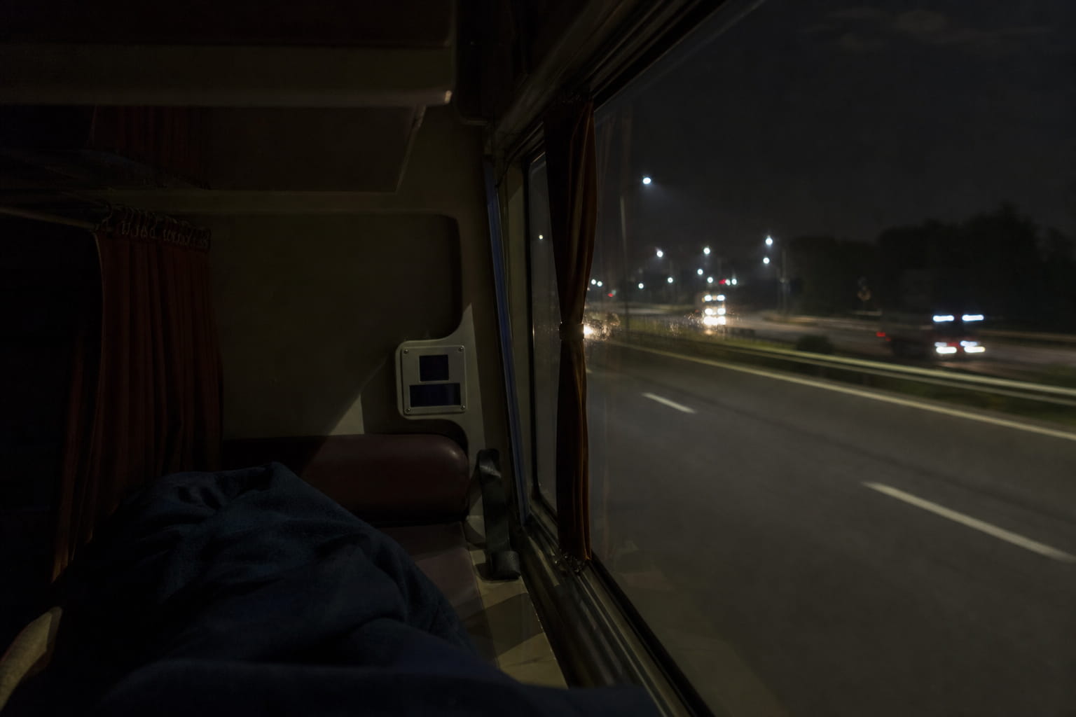Overnight bus travelling from Bangalore to Chennai on a highway