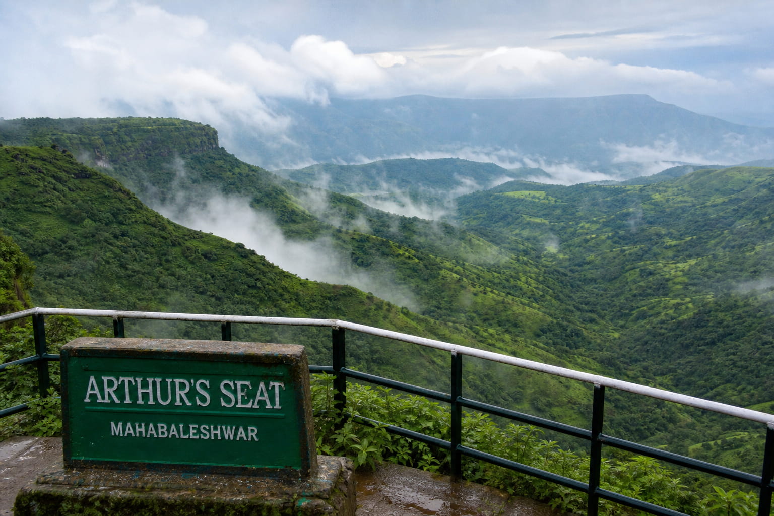 Rolling green valleys and mist at Arthur's Seat viewpoint in Mahabaleshwar hill station