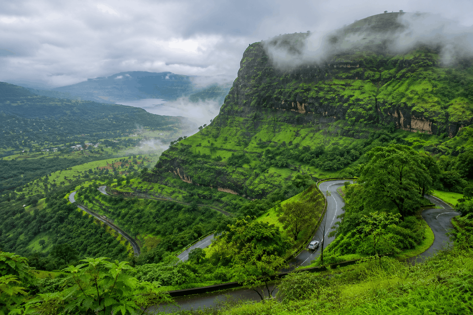 Green Sahyadri hills and winding roads near Pune in Maharashtra