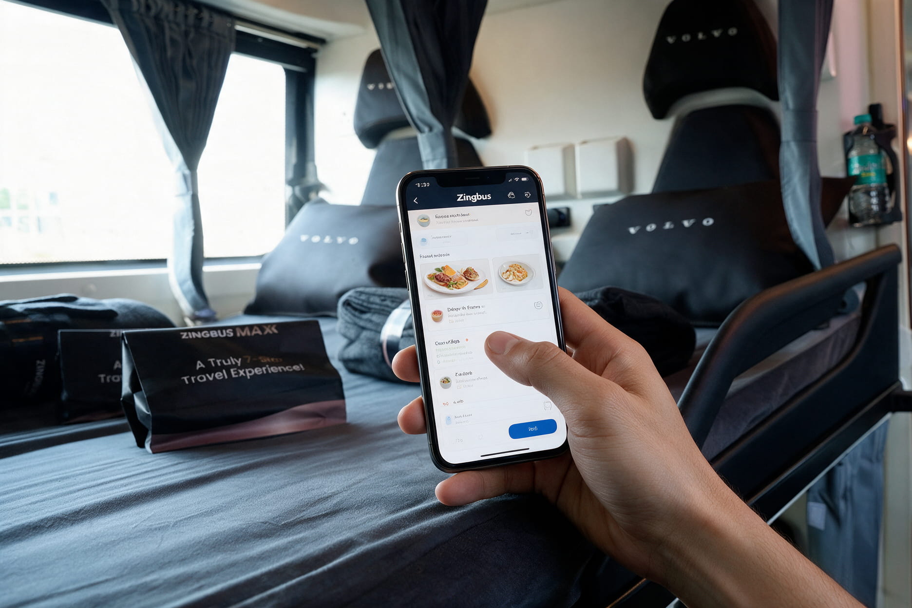 Hand using a smartphone to order food through the zingbus app while seated on an intercity bus
