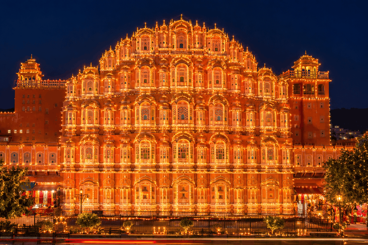 Hawa Mahal facade illuminated with thousands of lights at night during Diwali in Jaipur